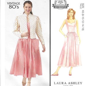 May include: Vintage McCall's sewing pattern for a dress and jacket. The pattern is for sizes K5 (8-10-12-14-16) and features a gingham print dress with a white jacket with polka dots. The pattern is from Laura Ashley, a brand known for its feminine and floral designs.