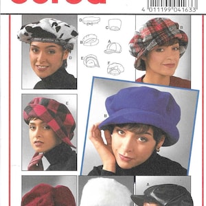 May include: A Burda sewing pattern envelope 4163 for various hat styles including a cow print beret, plaid bucket hat, solid blue cap, red bow-accented hat, white faux fur hat, and a black visor cap with head circumference sizes 52-60 cm.