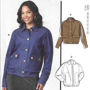 May include: McCall's sewing pattern M8607 featuring jacket designs. The image shows a woman wearing a blue denim jacket with gold buttons. The pattern includes multiple view options with simple instructions. Designed and printed in the USA.