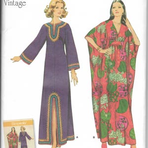May include: Simplicity vintage sewing pattern 8505 featuring two 1970s dresses. One dress is purple with a split front and decorative trim. The other is a red caftan with a floral print. The pattern is marked size S-L.