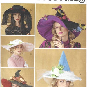 May include: Simplicity Costumes pattern S3031 featuring various costume hats. The hats include a black hat with a veil, a purple and black hat with butterfly accents, a pink hat with white flowers, a red and black hat with autumn leaves, and a blue witch hat.