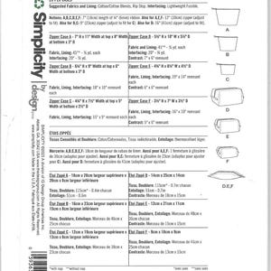 May include: A Simplicity S9872 sewing pattern envelope back featuring instructions for six zipper cases labeled A through F. The text includes fabric requirements, notions, and dimensions in inches and centimeters for each case design.