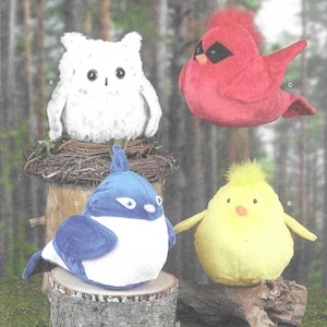 May include: Simplicity sewing pattern featuring four stuffed animal designs: an owl, a cardinal, a blue bird, and a chick. The pattern includes the text "S9972" and "easy-to-sew". The pattern is one size and designed and printed in the USA.
