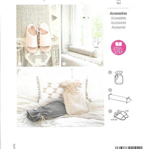 May include: A Burda Style sewing pattern featuring accessories. The image shows slippers, a bolster, and drawstring bags. The pattern includes instructions for easy sewing projects. The color scheme is neutral with soft textures.