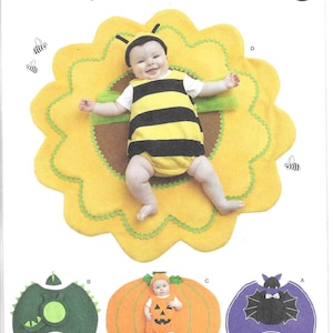May include: Simplicity Costumes pattern S9844 featuring infant outfits. Includes a yellow sunflower costume with a black and yellow bee romper, a green dragon costume, an orange pumpkin costume, and a purple bat costume with black wings.