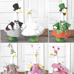 May include: Simplicity pattern S3223 featuring goose figures in various costumes. The geese are dressed in outfits such as a tuxedo, a wedding dress, a leprechaun suit, and a bunny costume. The pattern is one size and designed and printed in the USA.