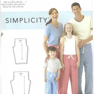 May include: A sewing pattern for pants, with a photo of a family wearing the pants. The pattern is for sizes XS-L/XS-XL and is called Simplicity S9132.