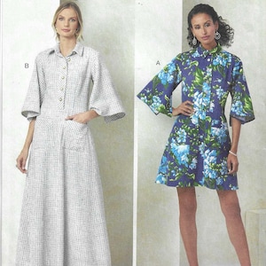 May include: Vogue Patterns sewing pattern featuring two dress designs. One dress is a long, button-down style with bell sleeves and pockets. The other is a shorter dress with a floral print and elbow-length sleeves. The pattern is designed and printed in the USA.