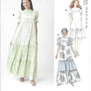 May include: McCall's sewing pattern M8652 featuring Laura Ashley designs. The pattern includes options for long, tiered dresses with floral prints. The image shows a model wearing a green floral dress and illustrations of other dress styles.