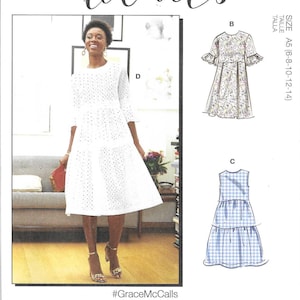 May include: McCall's sewing pattern M7948 features multiple dress designs. The image shows a woman wearing a white eyelet dress, and illustrations of other dress styles. Includes sizes A5 (6-8-10-12-14).
