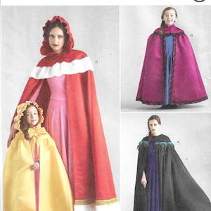 May include: Simplicity Costumes sewing pattern featuring capes in various styles. The image shows a red cape with white trim, a yellow cape, a magenta cape with black trim, and a black cape with feather accents. The pattern is easy-to-sew.