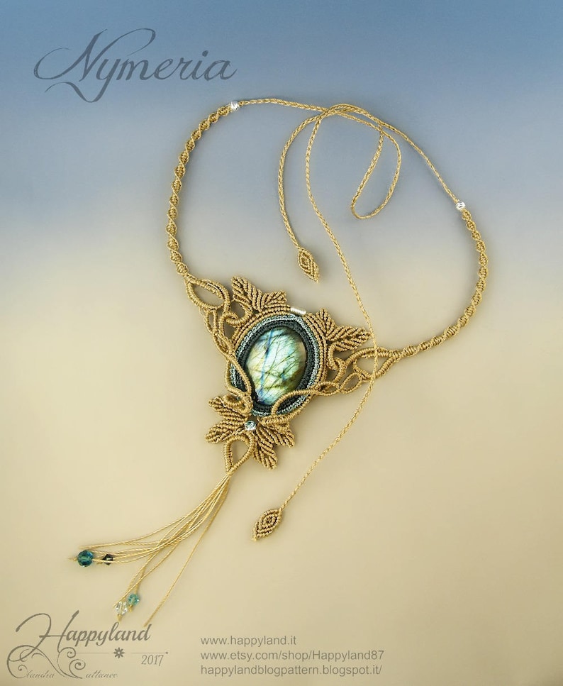 May include: A gold macrame necklace with a large green labradorite gemstone pendant. The necklace has a tassel and is called "Nymeria".