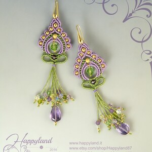 May include: Purple and green beaded earrings with gold accents and amethyst drops. The earrings are handmade and feature a floral design.