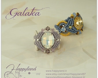 May include: Two handmade rings with a woven design and crystal stones. The ring on the left has a light purple woven design and a clear crystal stone. The ring on the right has a blue woven design and a gold crystal stone. The rings are on a white surface. The text "Galatea" is at the top of the image. The text "Happyland" is at the bottom of the image. The text "www.happyland.it", "www.etsy.com/shop/Happyland87", and "happylandblogpattern.blogspot.it" are also at the bottom of the image.