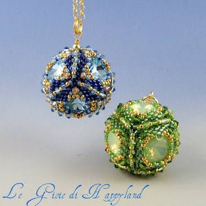 May include: Two beaded ornaments, one blue and one green, with gold accents and crystal-like beads. The ornaments are hanging from gold chains.