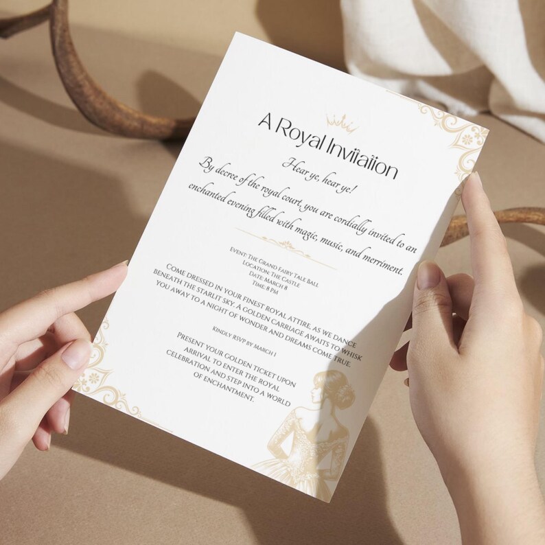 May include: A white invitation card with gold decorative accents and elegant script. The text reads "A Royal Invitation" and details for a grand fairy tale ball. Held by hands, the card suggests a formal event.