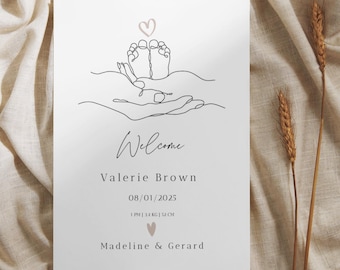 May include: A minimalist baby announcement card featuring a line drawing of baby feet in hands, a heart, and the word "Welcome." The card includes the baby's name, birthdate, time, weight, and parents' names.