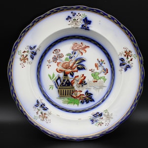A John Meir &#39;Antique Bottle&#39;  Flow Blue Pattern Soup Plate