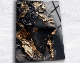 May include: A black and gold abstract portrait of a woman's face with gold leaf accents.