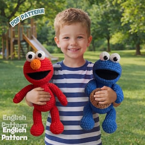 May include: Two handmade crochet dolls, one bright red and one deep blue, each featuring large white eyes with black pupils and wide black mouths. The blue doll holds a small brown textured cookie. Text reads PDF PATTERN and English Pattern.