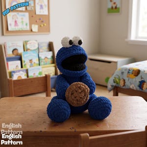May include: A blue crocheted plush toy with large white eyes and a black mouth, holding a textured brown cookie. The toy has a rounded head and body made of thick yarn. The text "PDF PATTERN" and "English Pattern" is visible in the image corners.