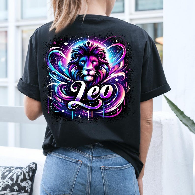 May include: Black t-shirt featuring a colourful graphic of a lion's head with the word "Leo" in a stylised font.