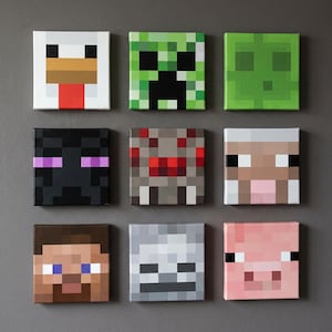 May include: A set of nine square canvas wall art pieces featuring pixelated character faces from a video game, including a chicken, creeper, slime, enderman, spider, sheep, human character, skeleton, and pig, arranged in a three-by-three grid.
