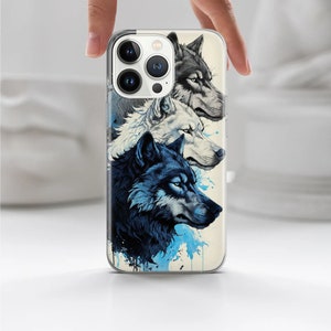 May include: A clear phone case with a design of three wolf heads. The wolves are in shades of blue and white, with a watercolor effect. The phone case is compatible with an iPhone.