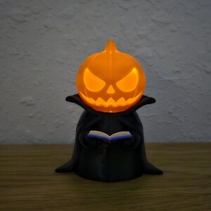 The Pagekeeper – Glowing Jack-o-Lantern Bookkeeper Figurine (4″) with Tealight Candle