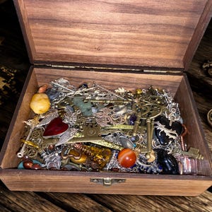 Mystery, witchy skeleton keys, clocks, moons,pentagrams, crystals, rough stones, necklace and assorted charms.