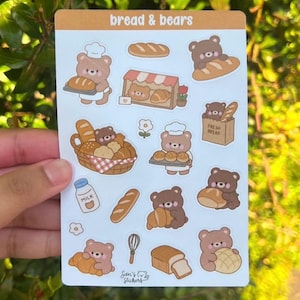 May include: A sticker sheet titled bread & bears featuring various illustrations of brown bears with bread, including a bear in a chef hat, a bakery stall, a basket of baked goods, a milk bottle, a whisk, and individual loaves of bread.