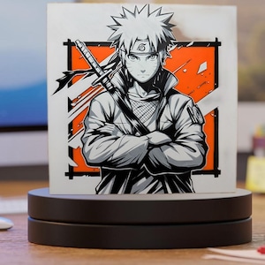 May include: A black and white illustration of an anime character with spiky blonde hair, a headband, and a sword. The character is set against an orange and white background. The artwork is displayed on a black rotating stand.
