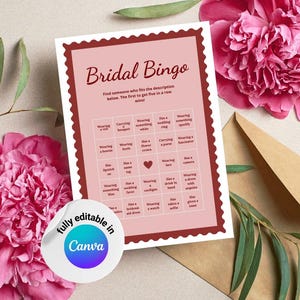 May include: A pink and white Bridal Bingo game card with a decorative border, featuring various wedding-related prompts. The card is surrounded by pink flowers, greenery, and a brown envelope. A sticker with the text "fully editable in Canva" is also present.