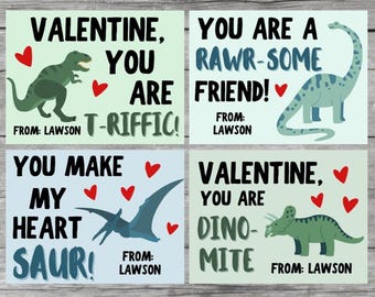 May include: Four Valentine's Day cards with dinosaur illustrations and pun-based messages. The cards feature a green T-Rex, a blue Brontosaurus, a blue Pterodactyl, and a green Triceratops, along with red heart accents. Each card includes the name "Lawson".