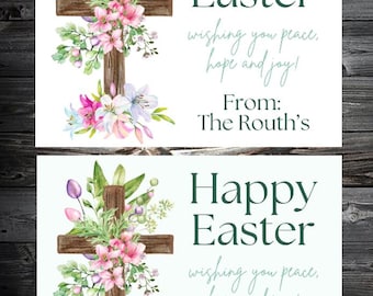 May include: Two Easter cards with a wooden cross adorned with pink, purple, and white flowers and greenery. The cards read "Happy Easter" and include the message "wishing you peace, hope and joy!" and "From: The Routh's."