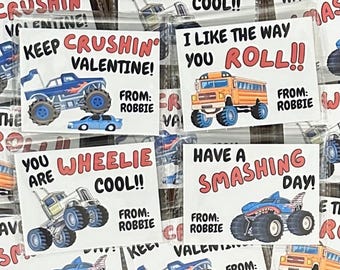 May include: A set of ten Valentine's Day cards featuring monster trucks, school buses, and other vehicles. The cards have different messages, such as "Keep Crushing Valentine!" and "You Are Wheelie Cool!" Each card has a "From: Robbie" signature.