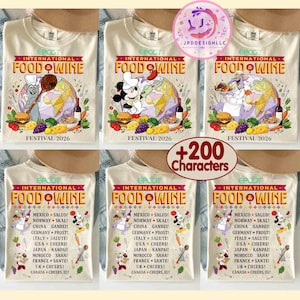 May include: A cream-coloured t-shirt featuring the Epcot International Food & Wine Festival 2026 logo, a globe, and various characters like Remy, Mickey Mouse, and Figment. The back displays a list of countries with their respective toasts.