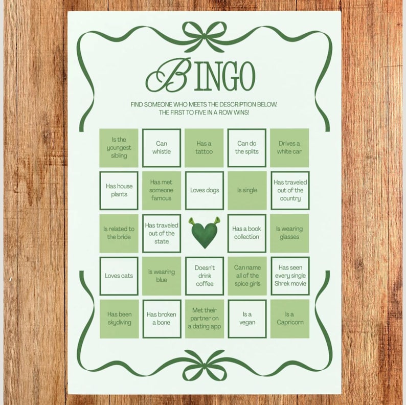 May include: A green and white Bingo game card with a decorative border. The card features a grid of descriptive prompts, such as "Loves dogs" and "Drives a white car." The word "BINGO" is at the top, and the instructions are below.