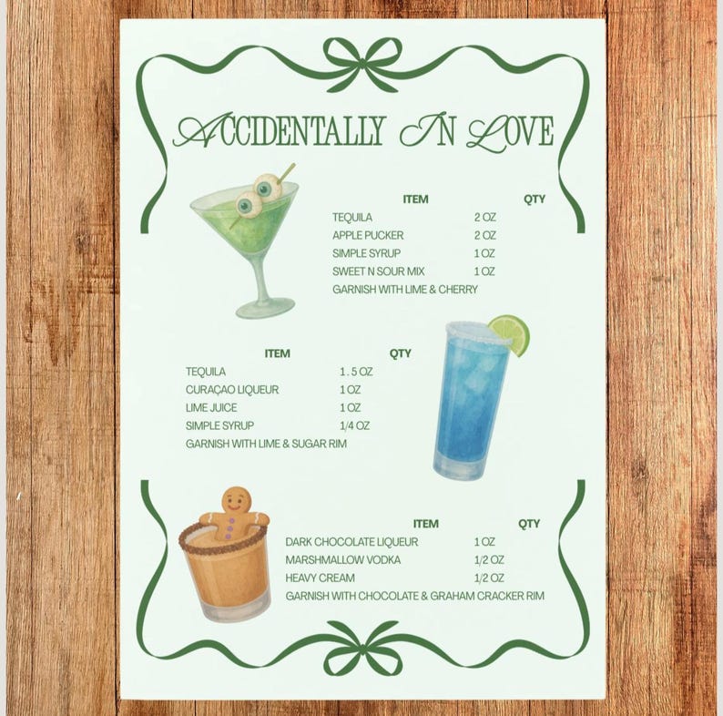 May include: A watercolor-style print on a wooden background features three cocktail recipes with the title "ACCIDENTALLY IN LOVE." Each recipe lists ingredients and quantities in fluid ounces, along with garnish suggestions. The design includes green decorative elements.