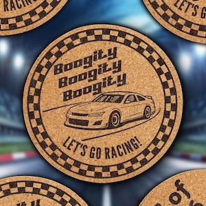 May include: Round cork coasters with a racing theme. Each coaster features a car graphic and the text "Boogity Boogity Boogity" and "Let's Go Racing!". The coasters have a checkered border.