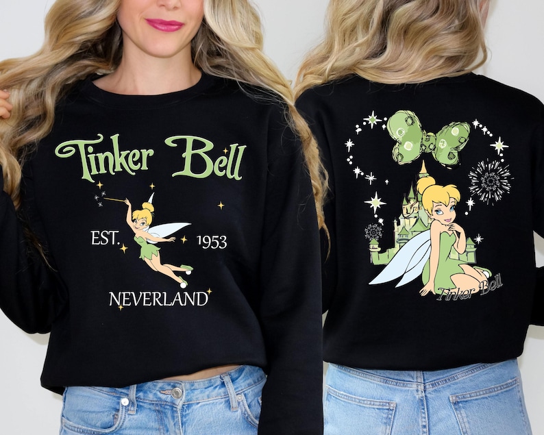 a woman wearing a black tinker bell sweatshirt