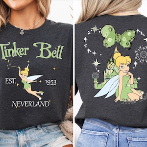 a woman wearing a tinker bell t - shirt