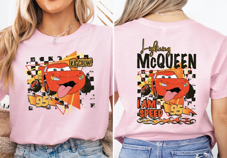 a woman wearing a pink disney cars t - shirt