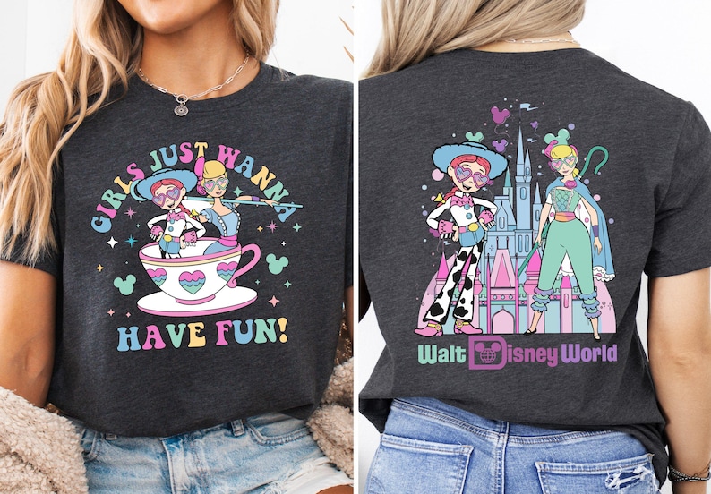 a woman wearing a black shirt with cartoon characters on it