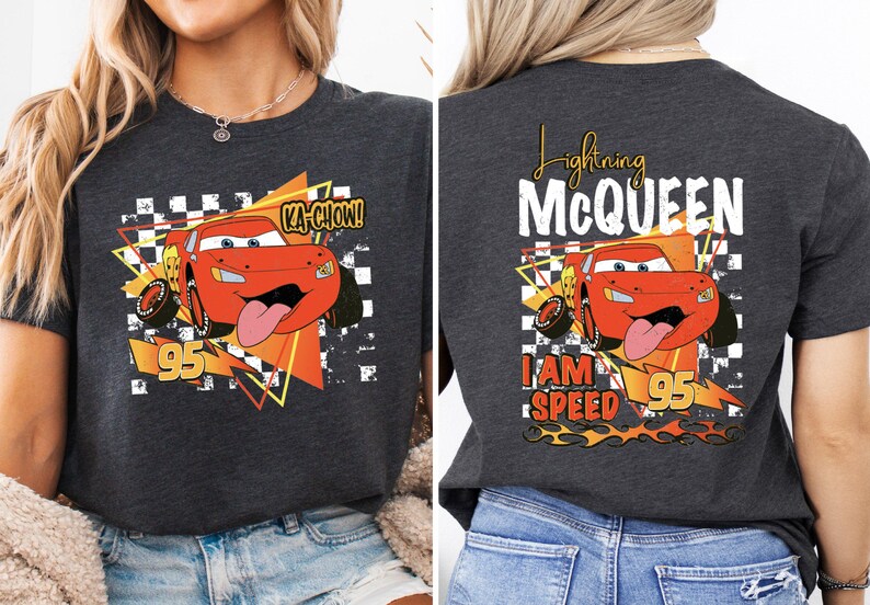 a woman wearing a black t - shirt with a cartoon character on it