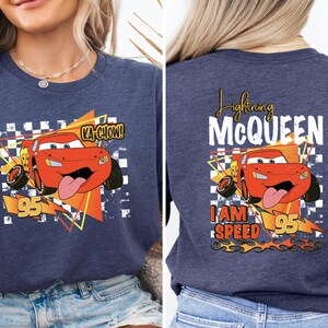 a woman wearing a t - shirt with a cartoon character on it