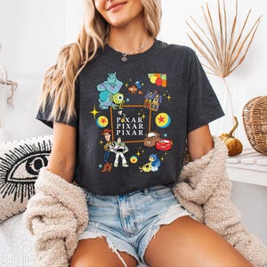 a woman sitting on a bed wearing a black shirt