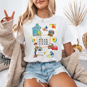 a woman sitting on a bed with her peace sign