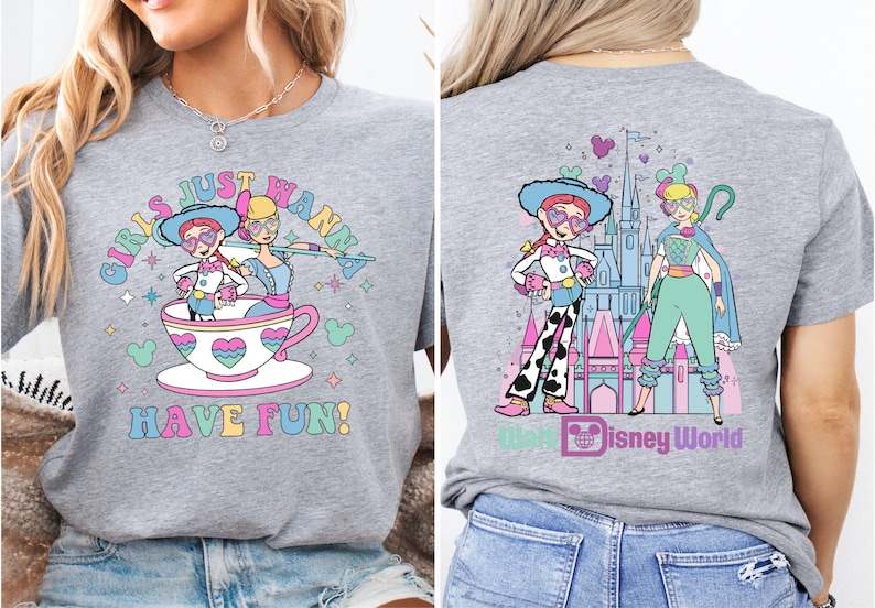 a woman wearing a gray shirt with a cartoon character on it