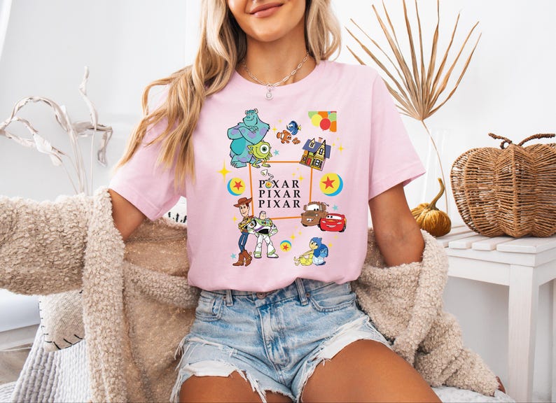 a woman sitting on a bench wearing a pink shirt